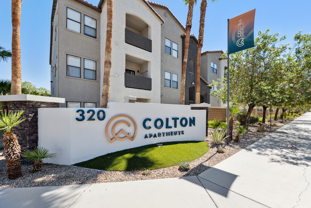 an apartment building with a sign that reads colton apartments