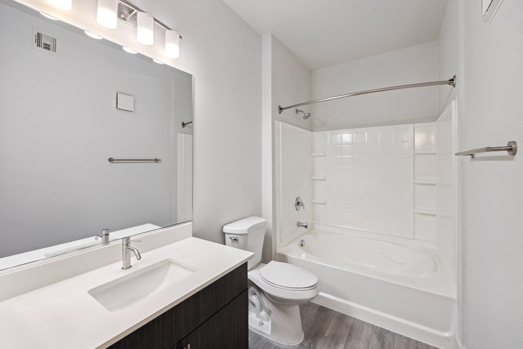 a bathroom with a sink toilet and a shower