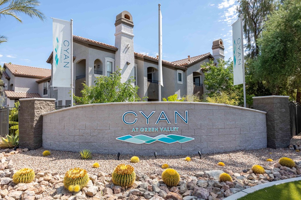 the cyan at green valley apartments sign in front of the building