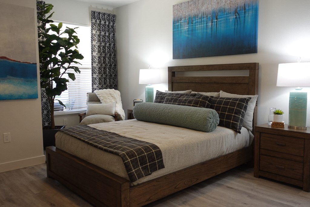 a bedroom with a bed and a window