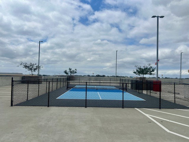 a tennis court with a fence around it