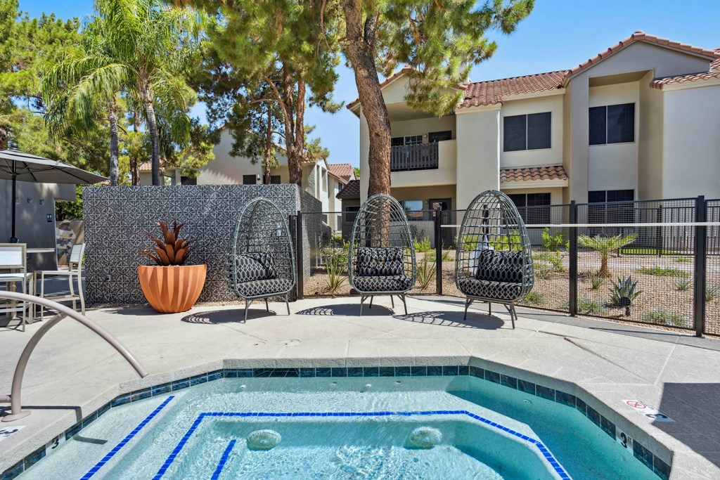 hot tub spa with outdoor chairs at hideaway apartments in north scottsdale