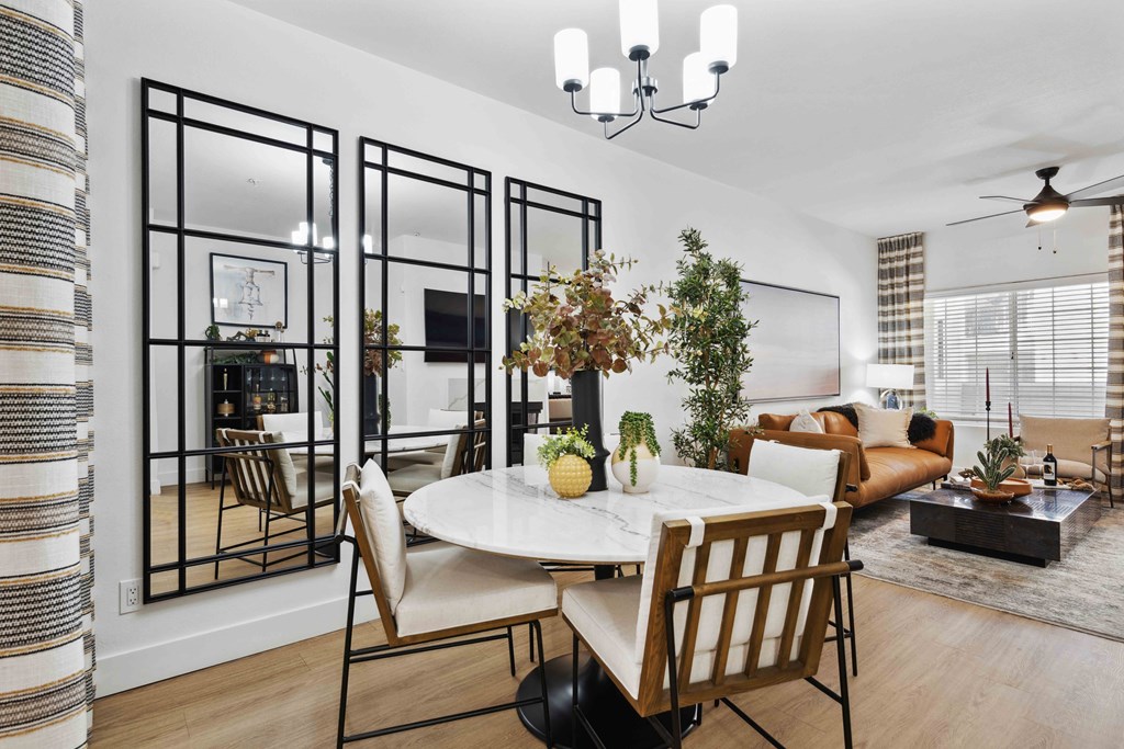 a dining room with a table and chairs