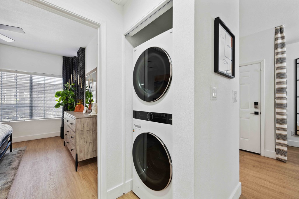a front load washer and dryer in a laundry room