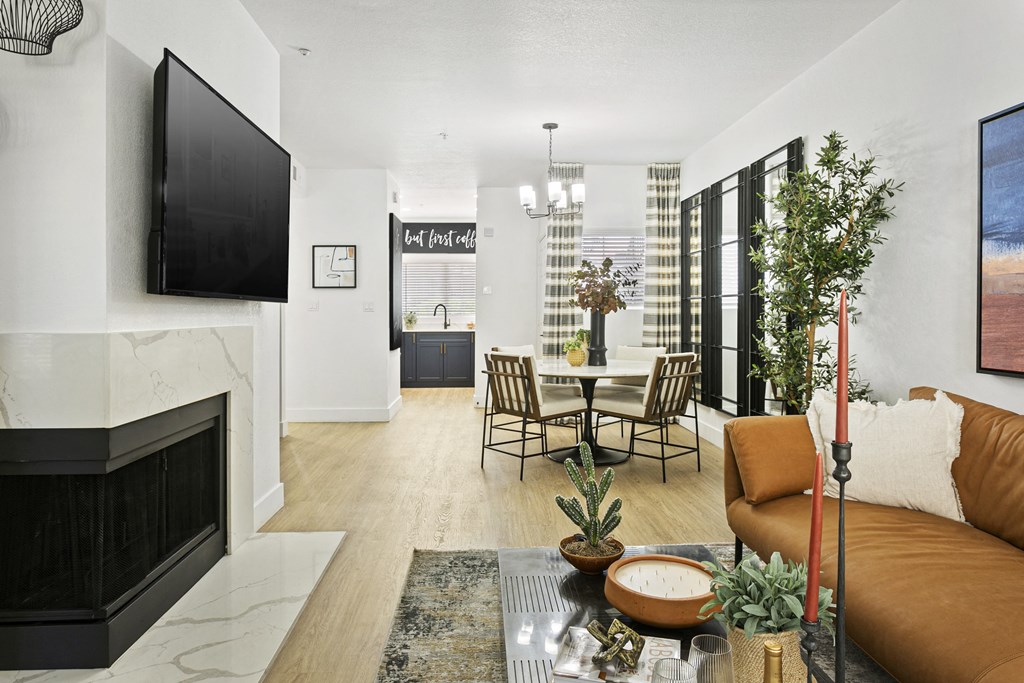 a living room with a couch and a table and a television