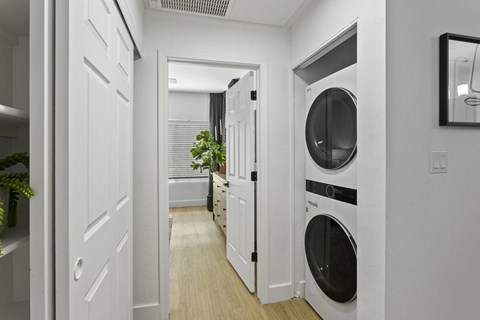 a small laundry room with a washer and dryer in it