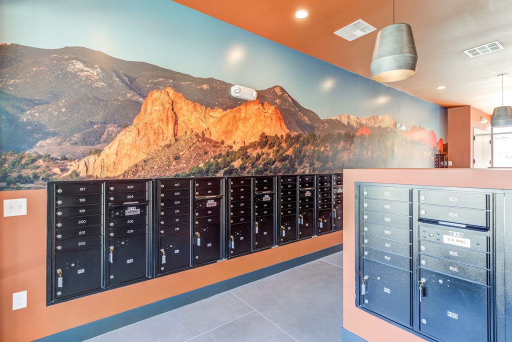 a large mural of a mountain on the wall of a locker room