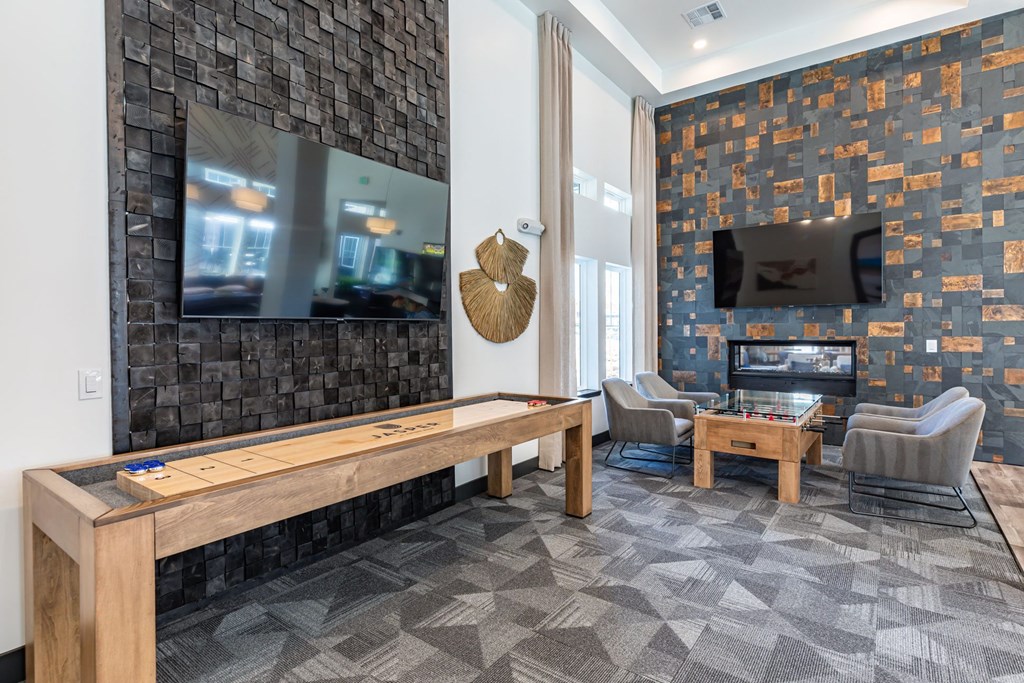 a game room with a pool table and a television