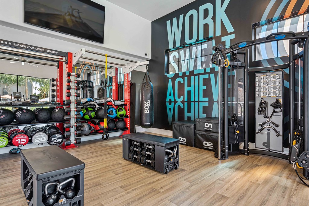 fitness center with weights and machines at lazo apartment homes in arizona