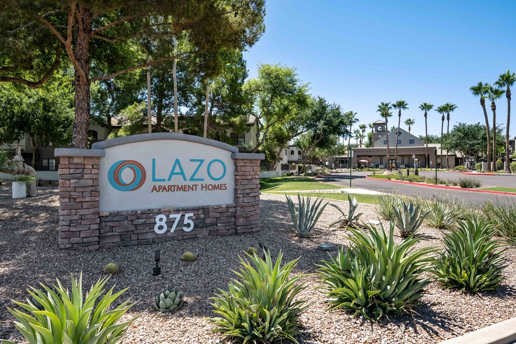 a sign with for lazo apartment homes logo