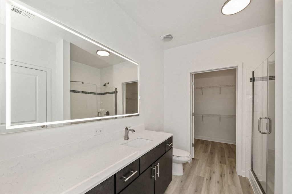 a bathroom with a large mirror and a large sink