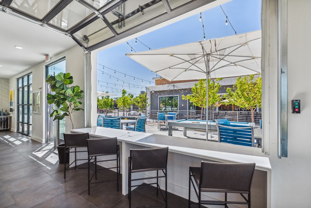 a view of the outdoor patio from inside the building