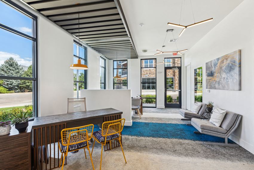 The Mezz, Centennial, CO, Lobby a living room with white walls and a large window - Photo Gallery