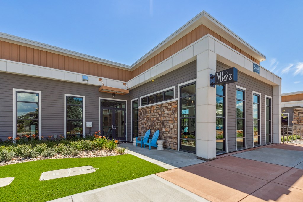 a building with glass doors and a sign that says water
