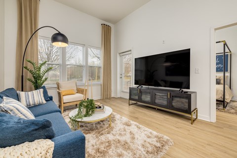 a living room with a couch and a tv