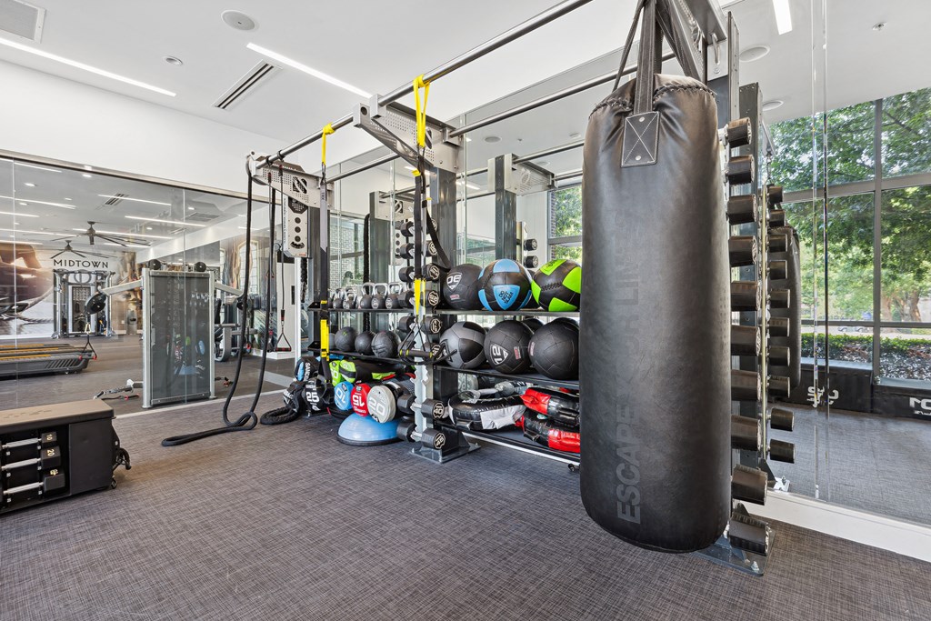 a large punching bag hangs in the corner of a gym
