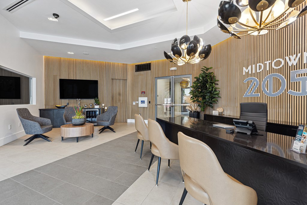 a lobby with a reception desk and chairs