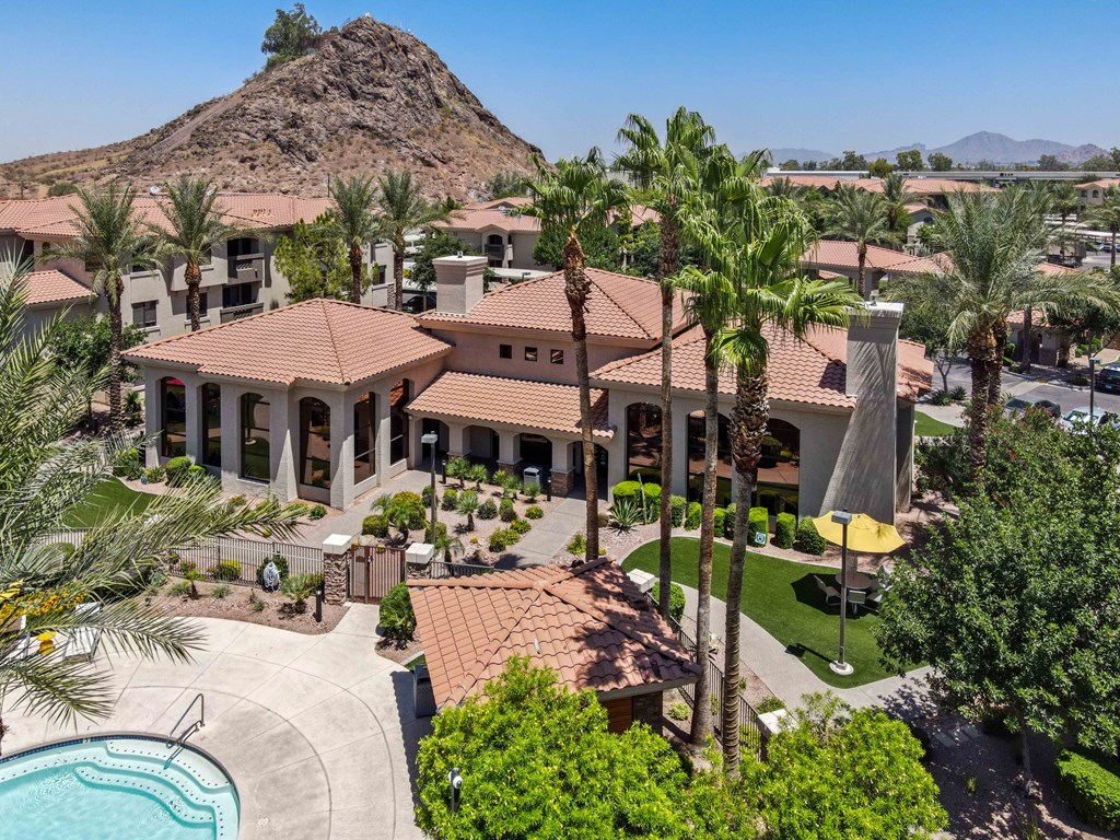 an aerial view of the resort apartment with a mountain in the background