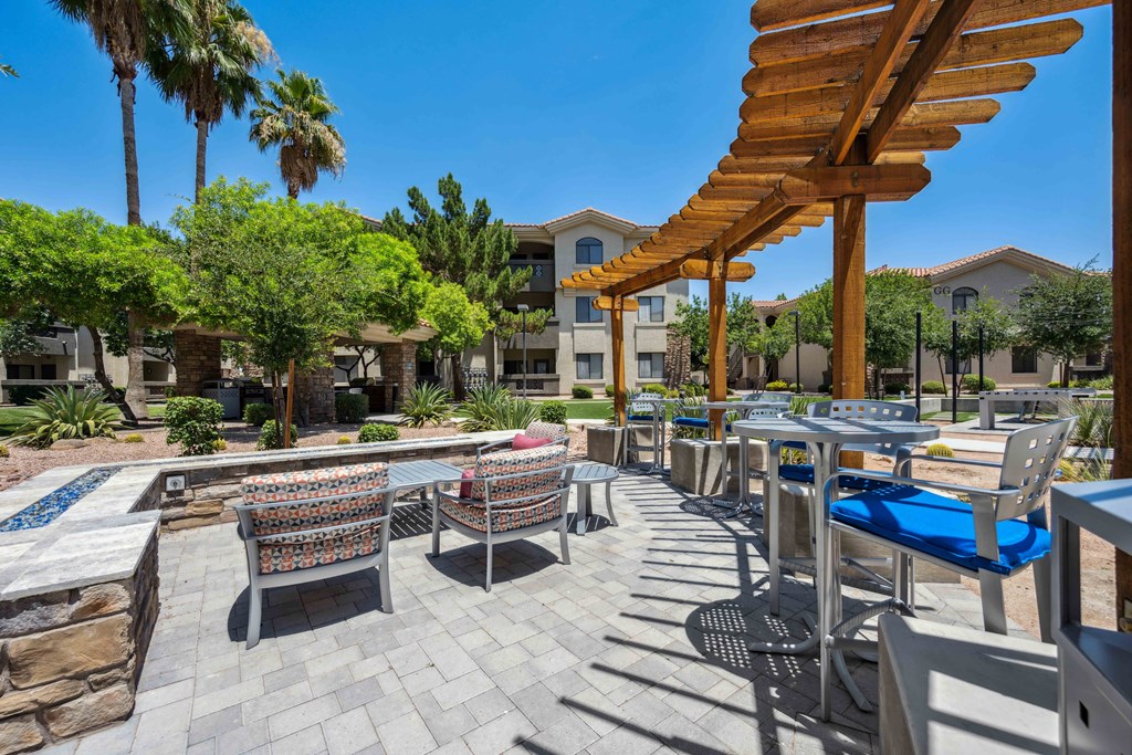 an outdoor patio with a firepit