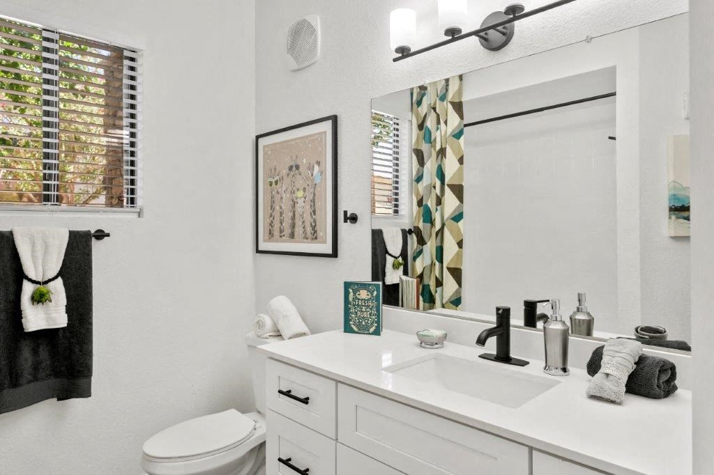 arizona apartment bathroom with white cabinets