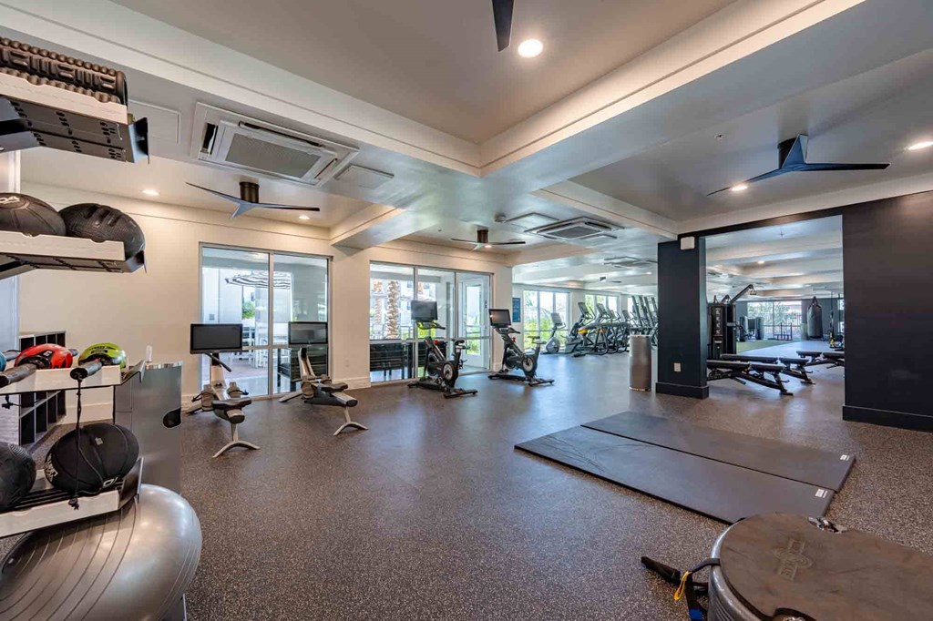a spacious fitness center with cardio equipment and weights at slate scottsdale apartments in arizona