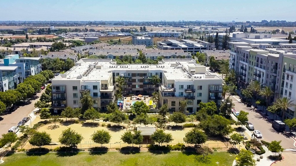 an aerial view of a city with buildings and trees
