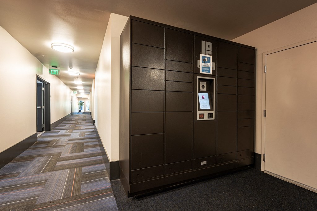 a hallway with elevators and doors in a building
