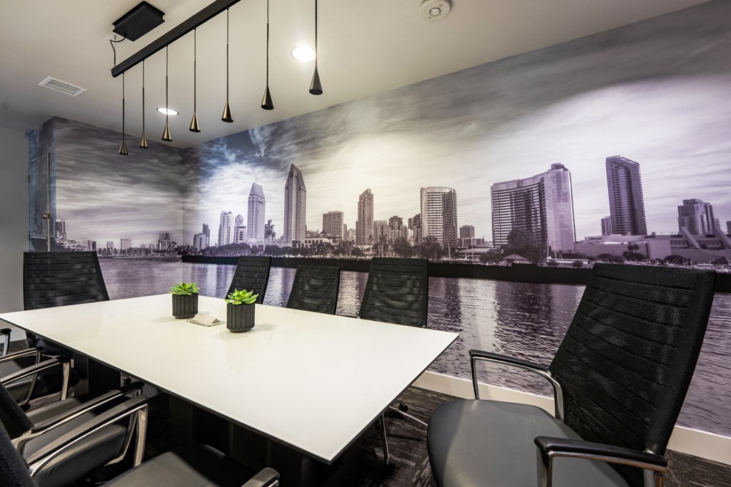 a dining room with a mural of a city on the wall