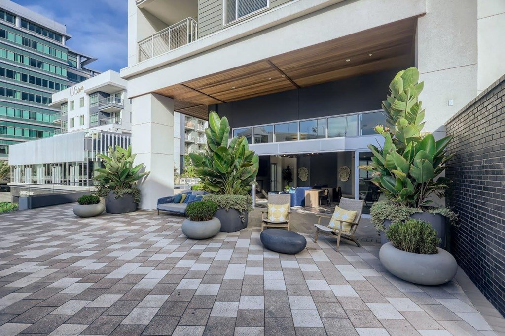 the lobby or reception area of an office building with plants
