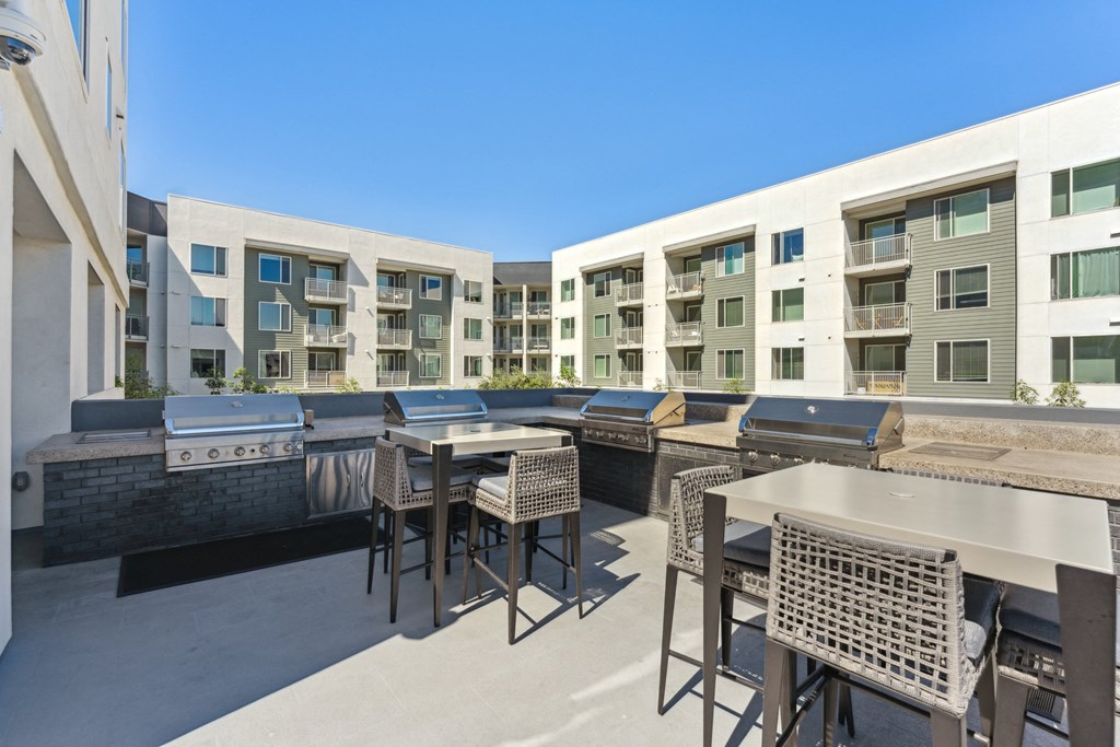 furnished patio with tables and chairs apartments