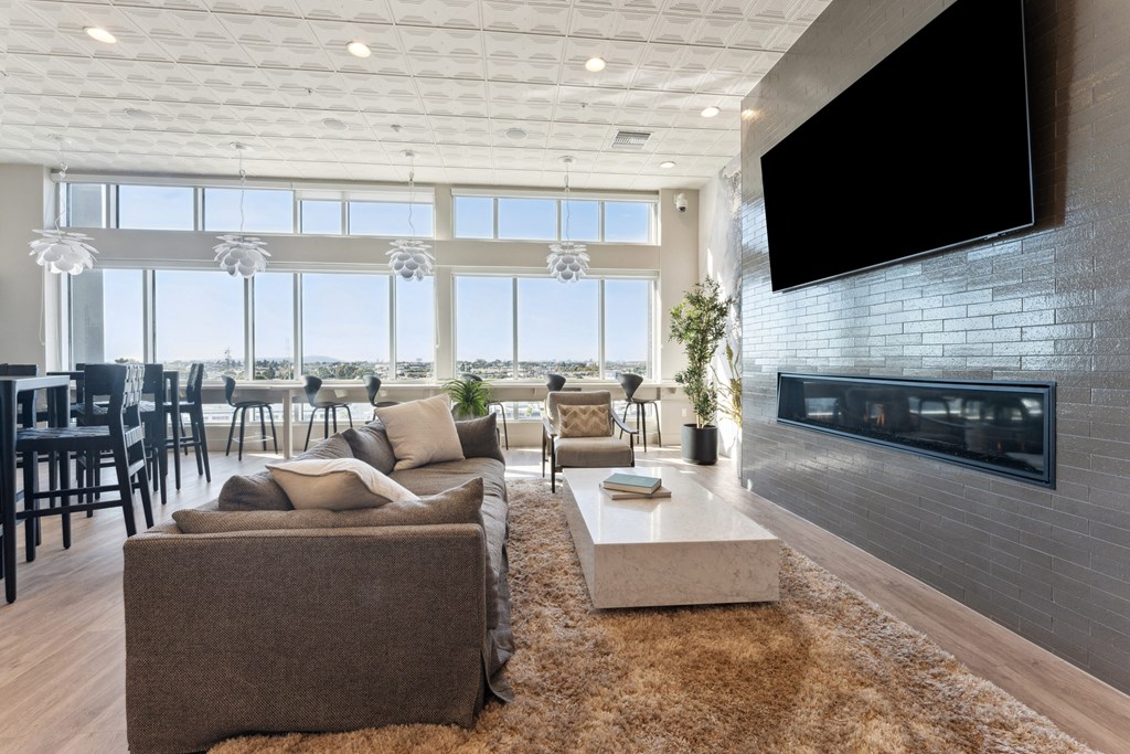 a living room with a couch and a coffee table and a television