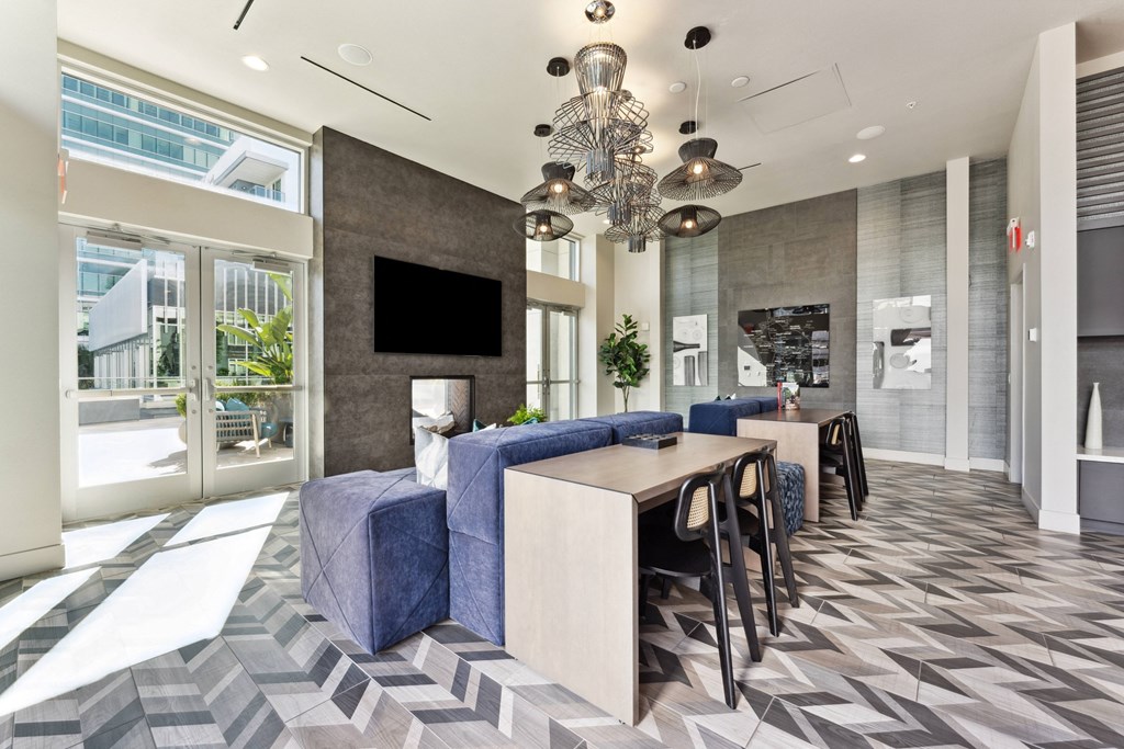 a dining room with a long table and chairs in a lobby