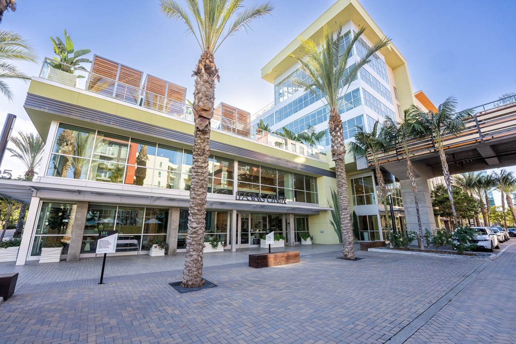 a building with palm trees in front of it