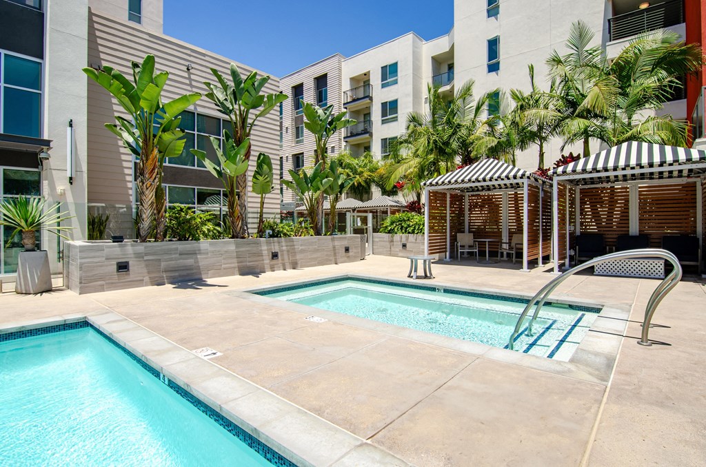 a swimming pool with a building in the background