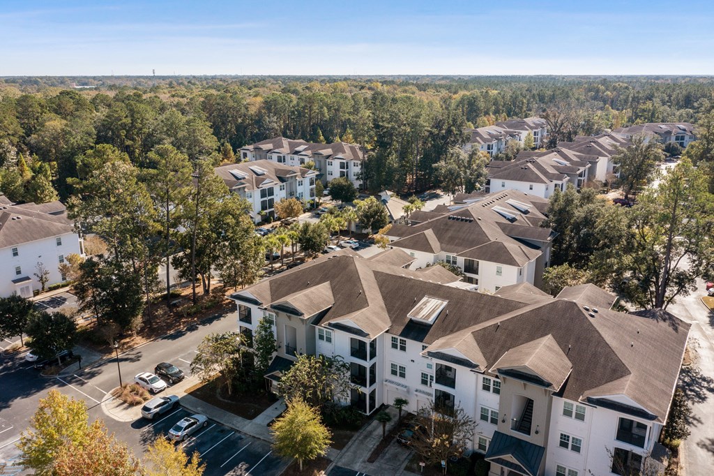 an aerial view of a neighborhood with houses and trees
