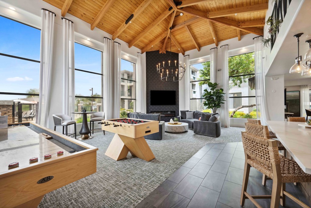 Clubhouse with a pool table and a foosball table