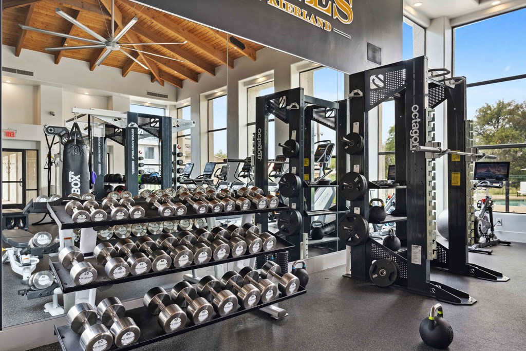 a fully equipped fitness center with weights and other exercise equipment