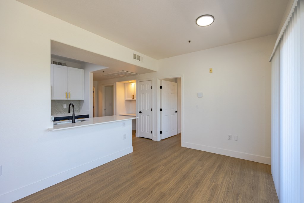 a kitchen and living room in an apartment
