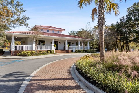 a house with a porch and a street in front of it