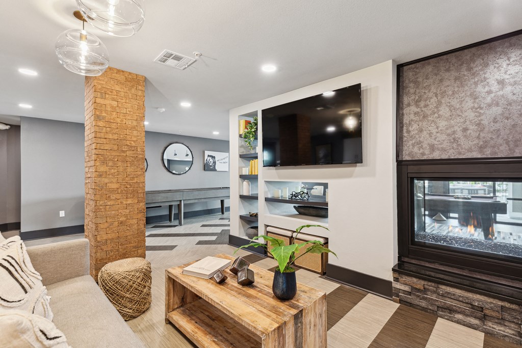 a living room with a fireplace and a table