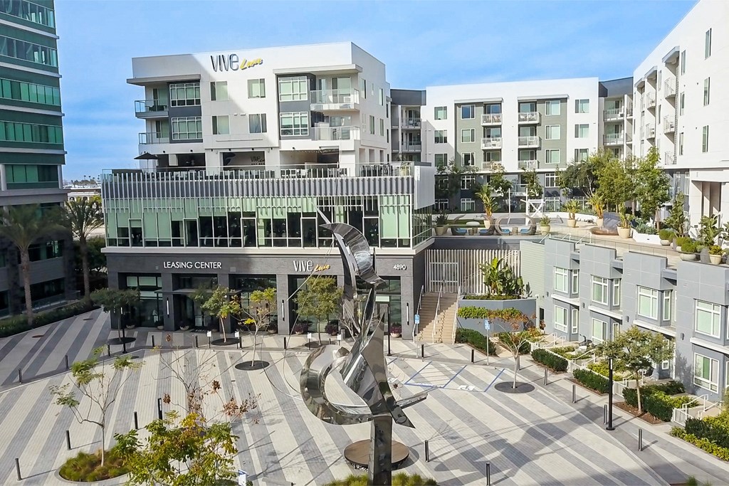 a view of the building with a sculpture in front of it