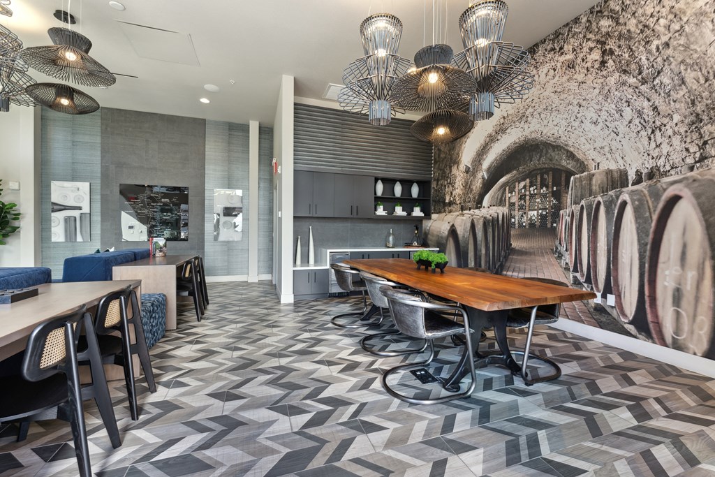 a dining room with a wooden table and chairs and a wall with an arched
