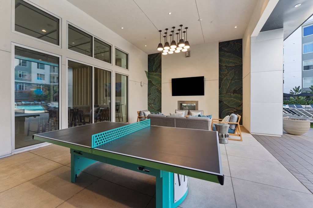 a ping pong table in the living room of a house