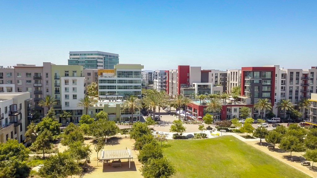 A cityscape with a mix of residential and commercial buildings.