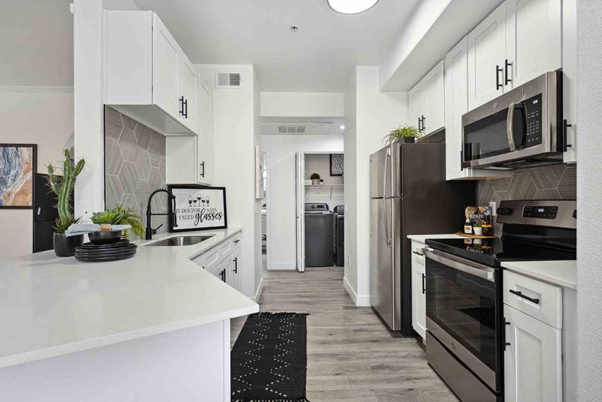 Zone, Glendale, AZ, Kitchen a kitchen with white cabinets and stainless steel appliances - Photo Gallery