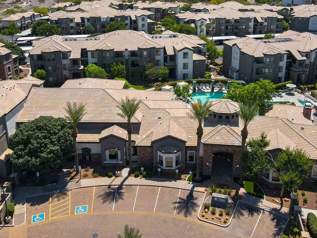 an aerial view of a community with several houses and a swimming pool