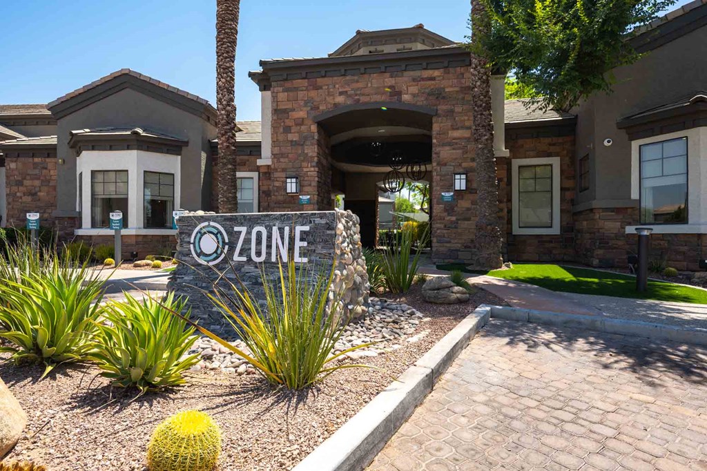 a home with a zone sign in front of it