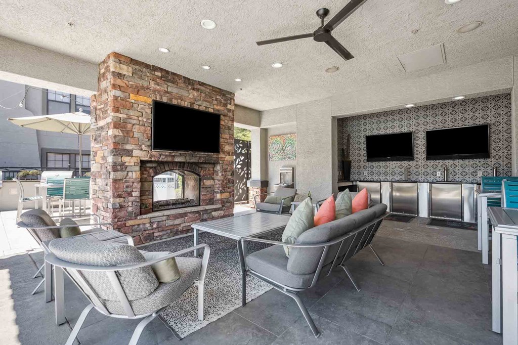 the zone luxe apartments outdoor lounge fireplace