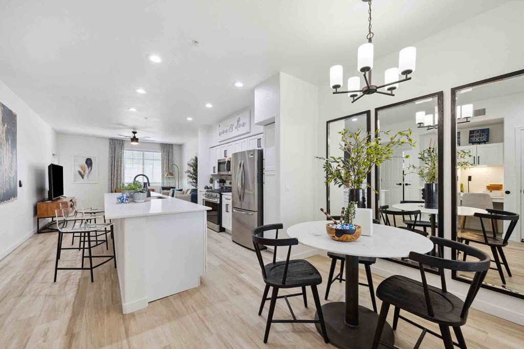 Spacious and bright dining and kitchen with natural light and kitchen island at Zone Luxe, apartment rentals Glendale AZ.