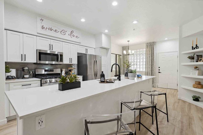 Zone Luxe, Glendale, AZ, Kitchen a kitchen with a large counter and two stools - Photo Gallery